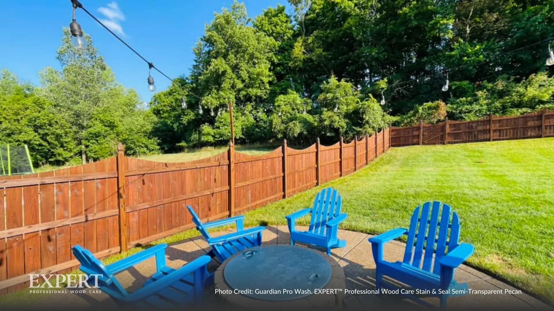 Backyard privacy fence with patio chairs, finished with EXPERT Stain & Seal