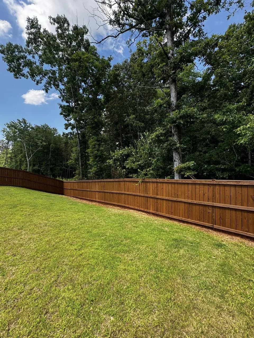 Backyard fence finished with EXPERT Stain & Seal in Palomino