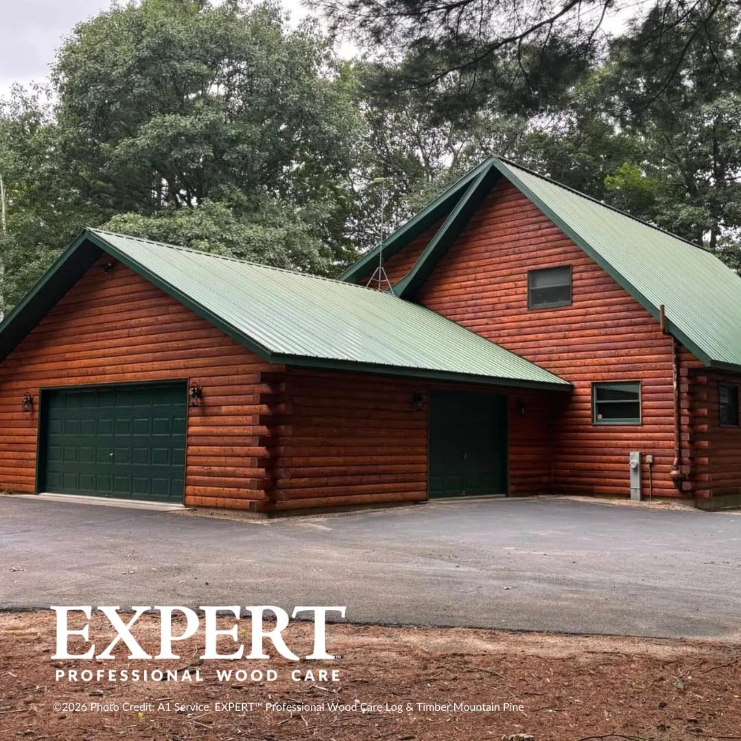Log home and garage finished with EXPERT Log & Timber in Mountain Pine