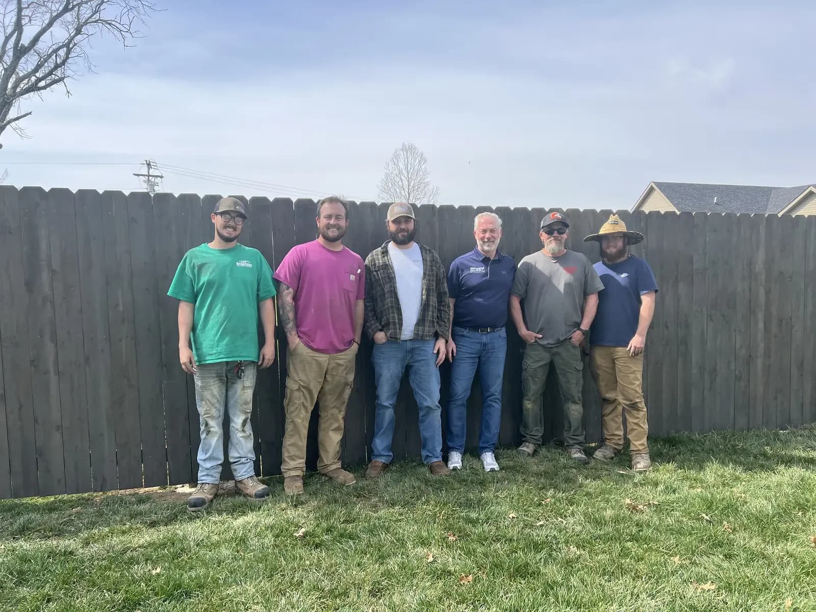 Ballard Fence Company crew with a finished Gopher Wood fence
