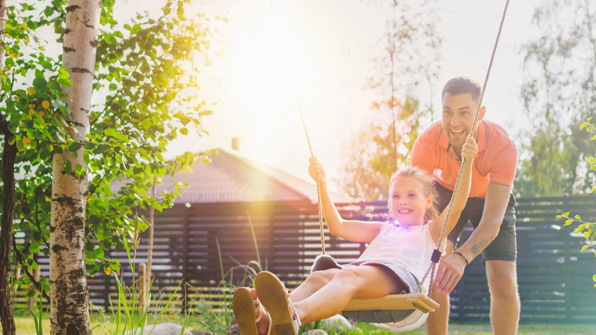 Family on a backyard swing