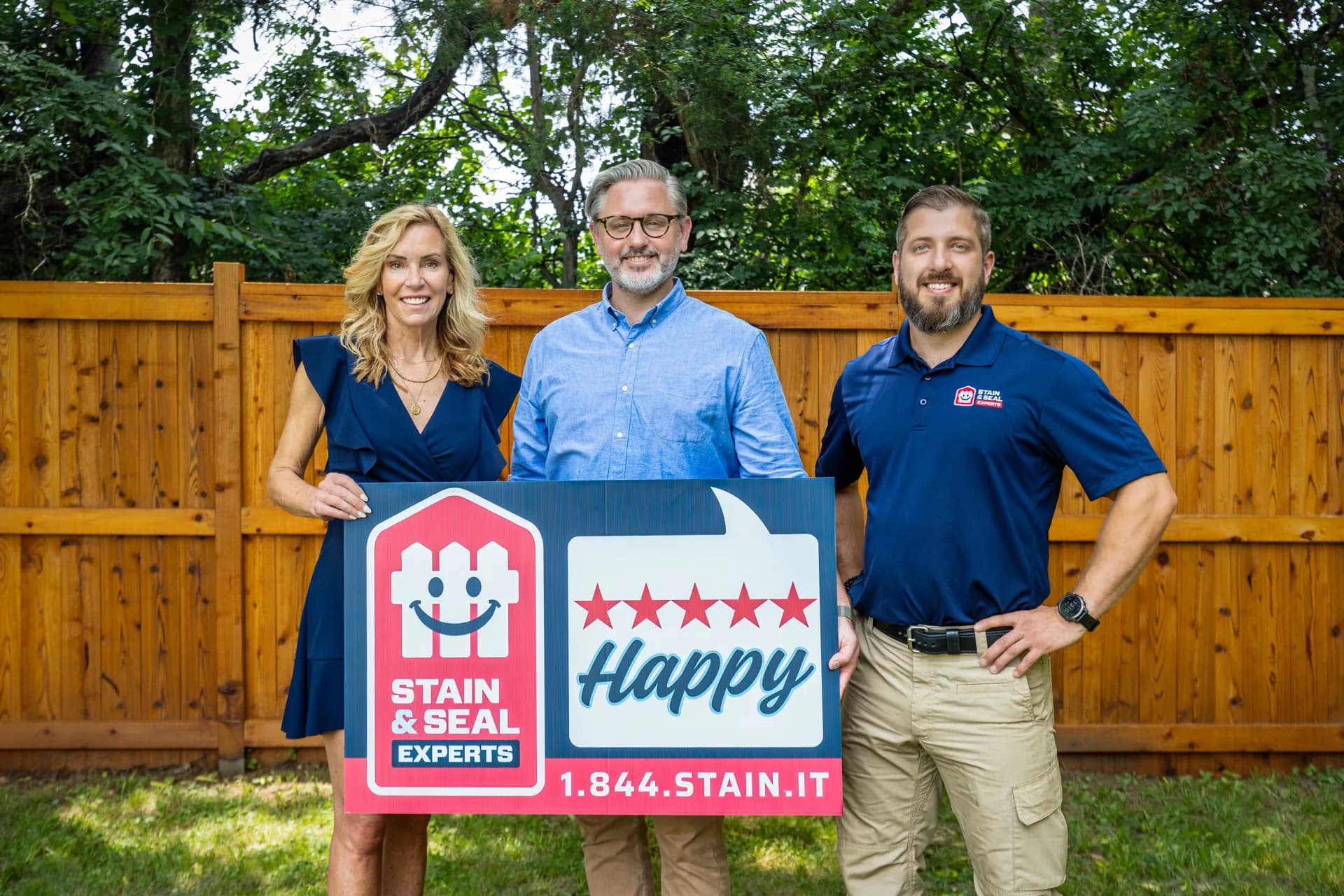 Stain & Seal Experts team with a 100% Happy yard sign