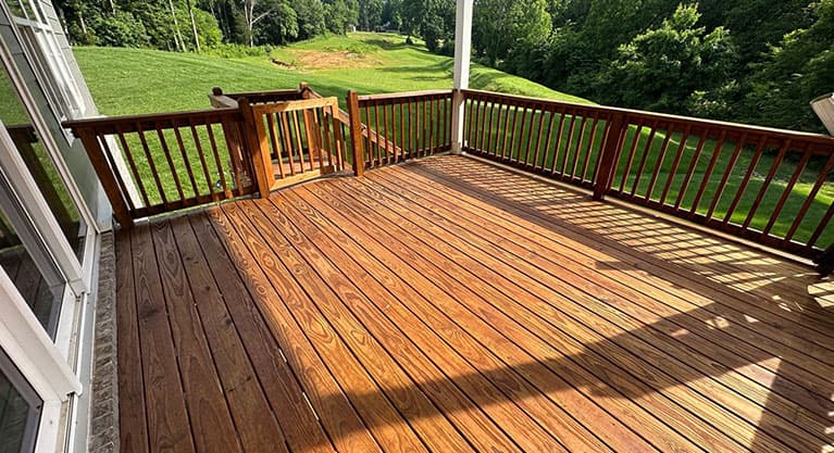 Beautifully stained wood deck at golden hour
