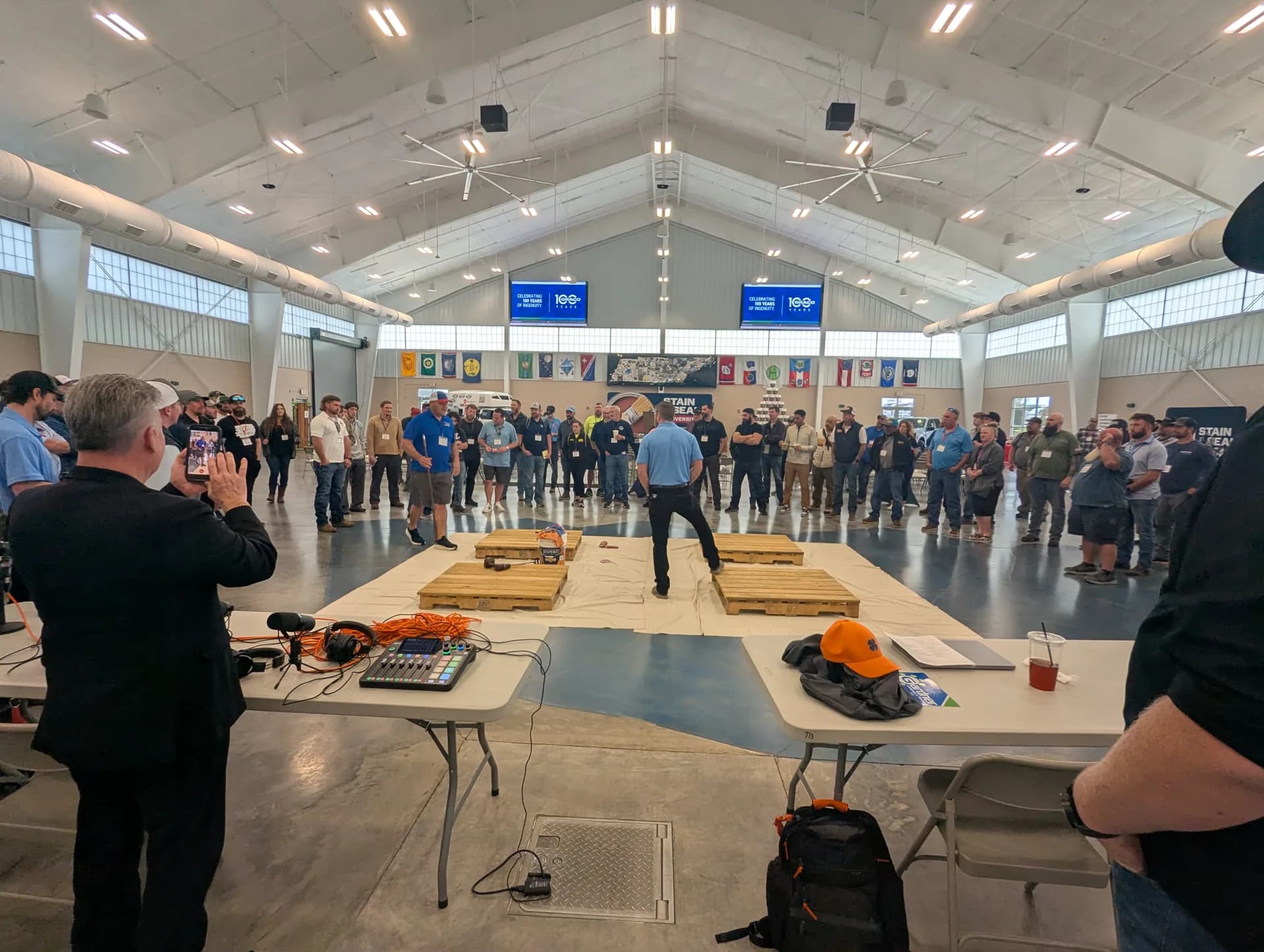 Contractors circled around a live demo in the main hall